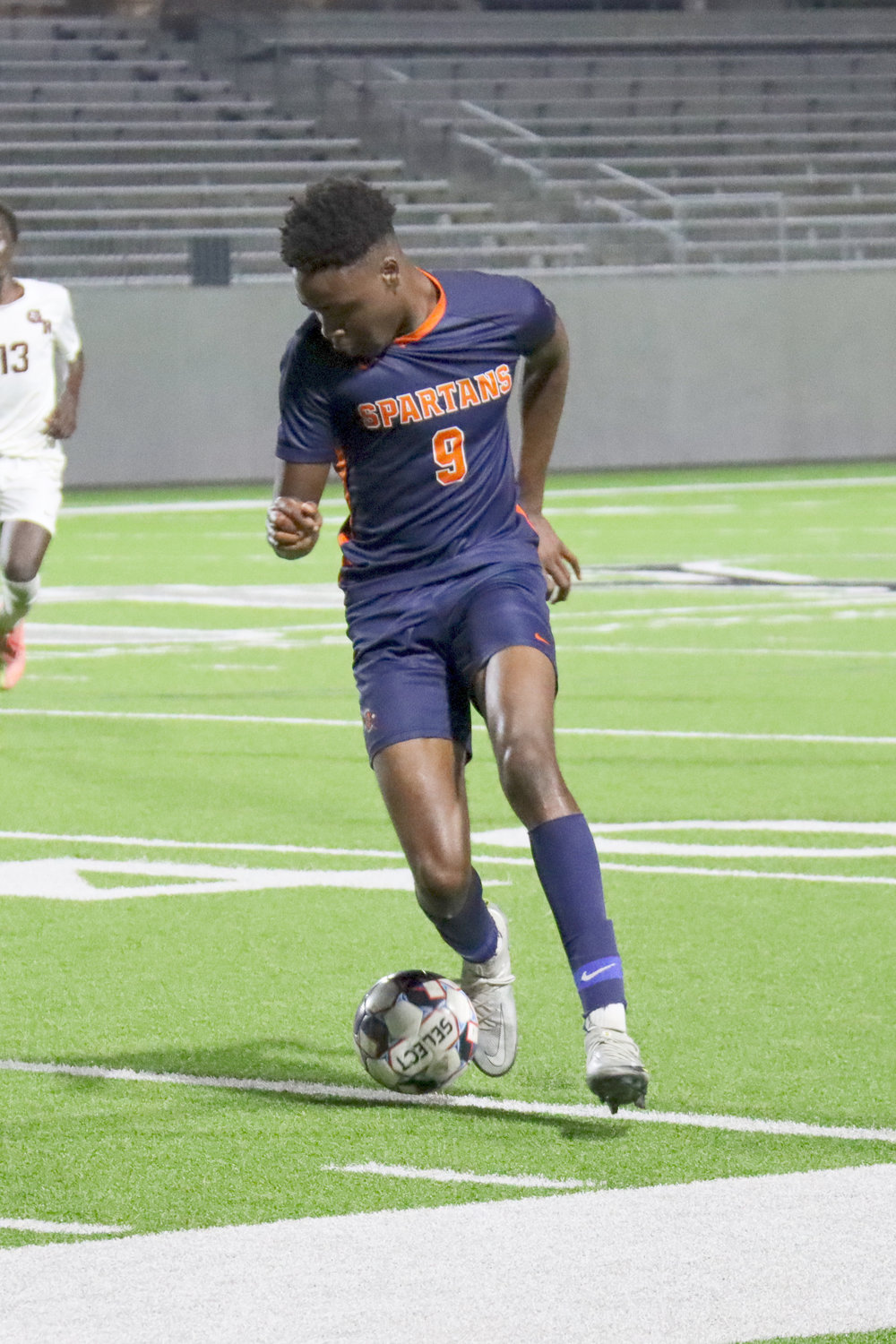 Seven Lakes senior Bryan Egba controls possession during the Spartans’ 5-2 Class 6A bi-district playoff win over George Ranch on Friday, March 25, at Legacy Stadium.